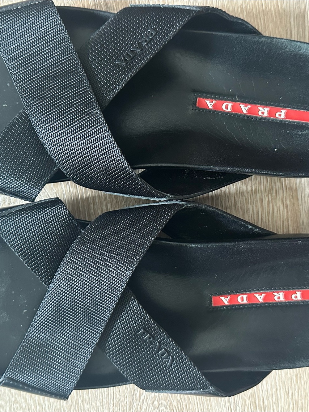 Prada Black Leather Crisscross Slide Sandals with Red Logo Accent